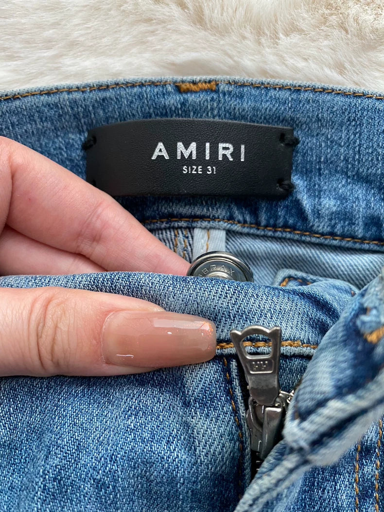 Amiri Distressed Patchwork Denim Jeans