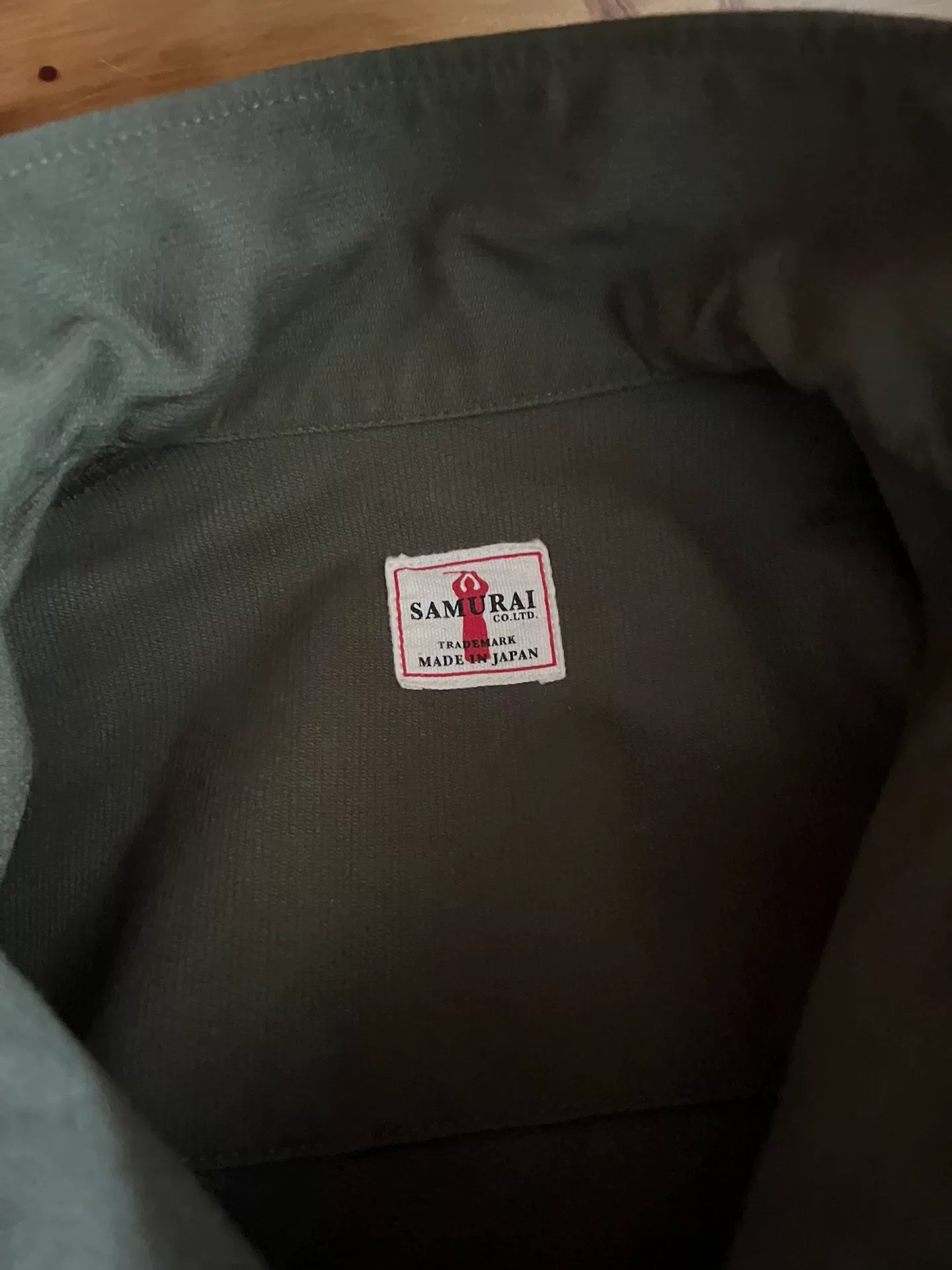 olive green bomber jacket with four pockets