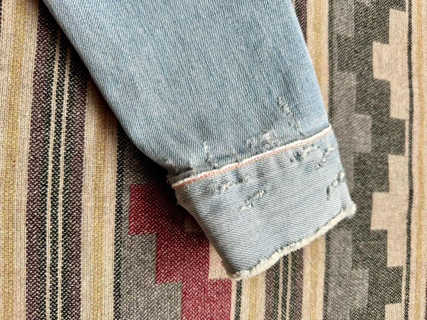 denim jacket with distressed details