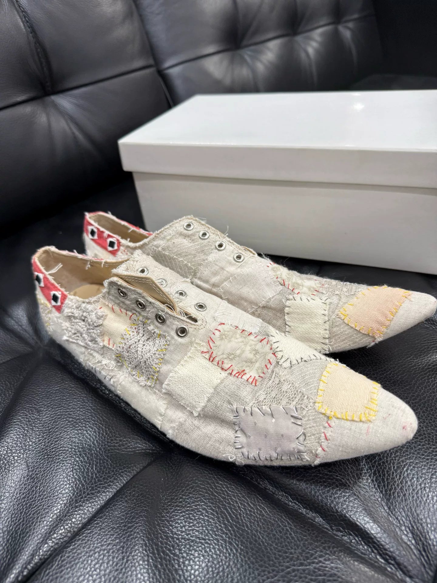 patched pointed toe boots in condition