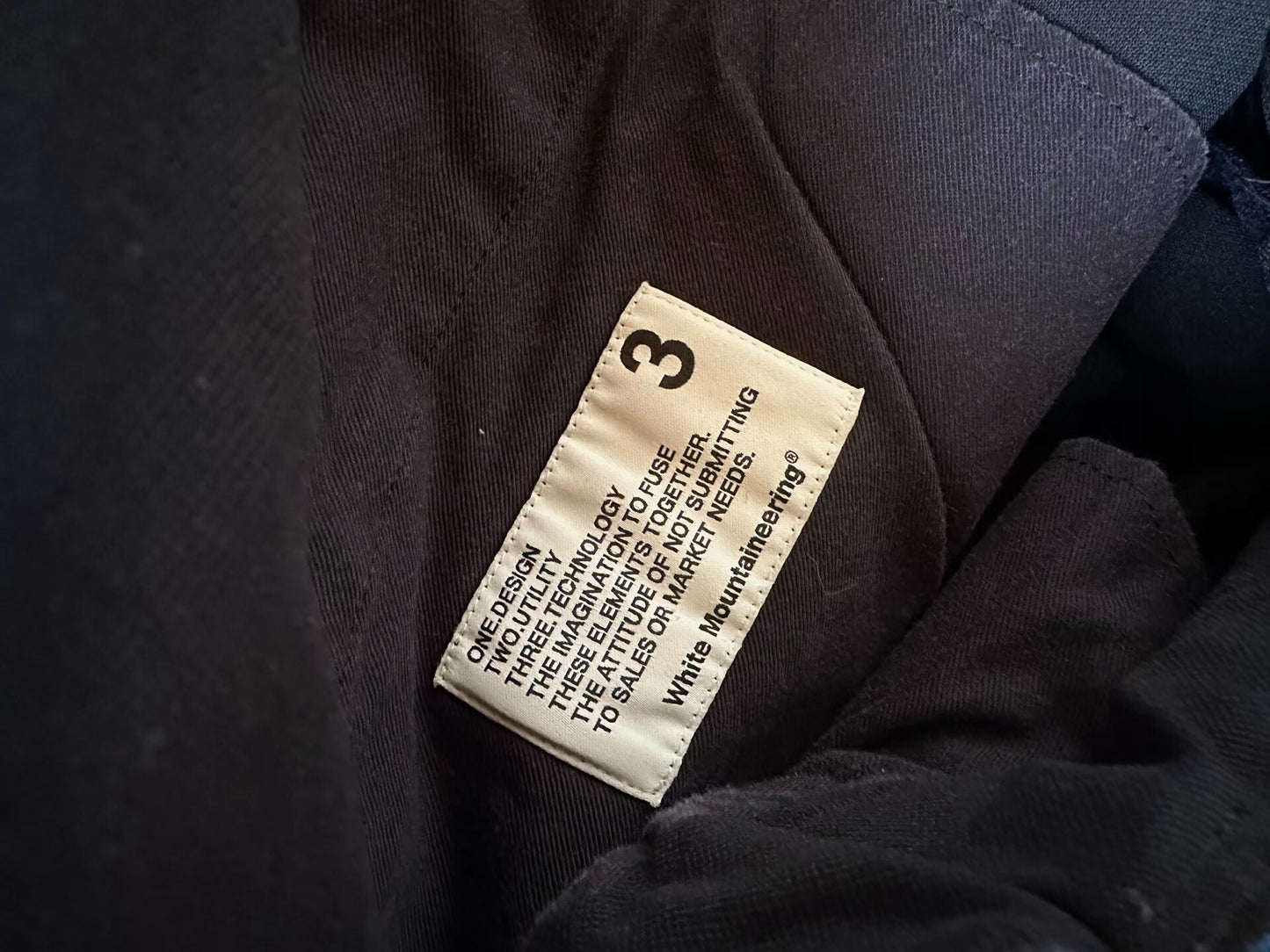 white mountaineering functional shorts with quick-dry fabric