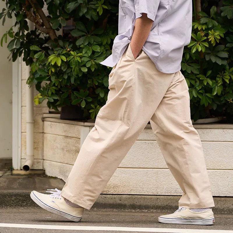KUON Tapered Trousers in Beige Color