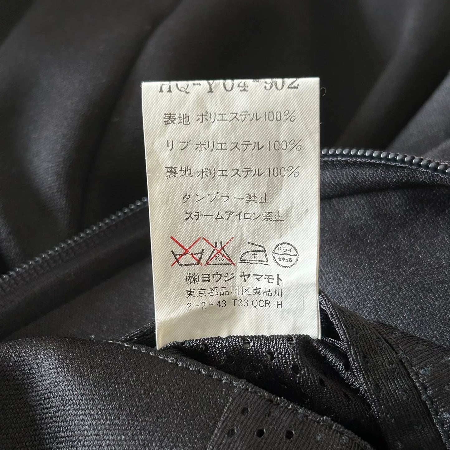 black zip jacket with embroidery details