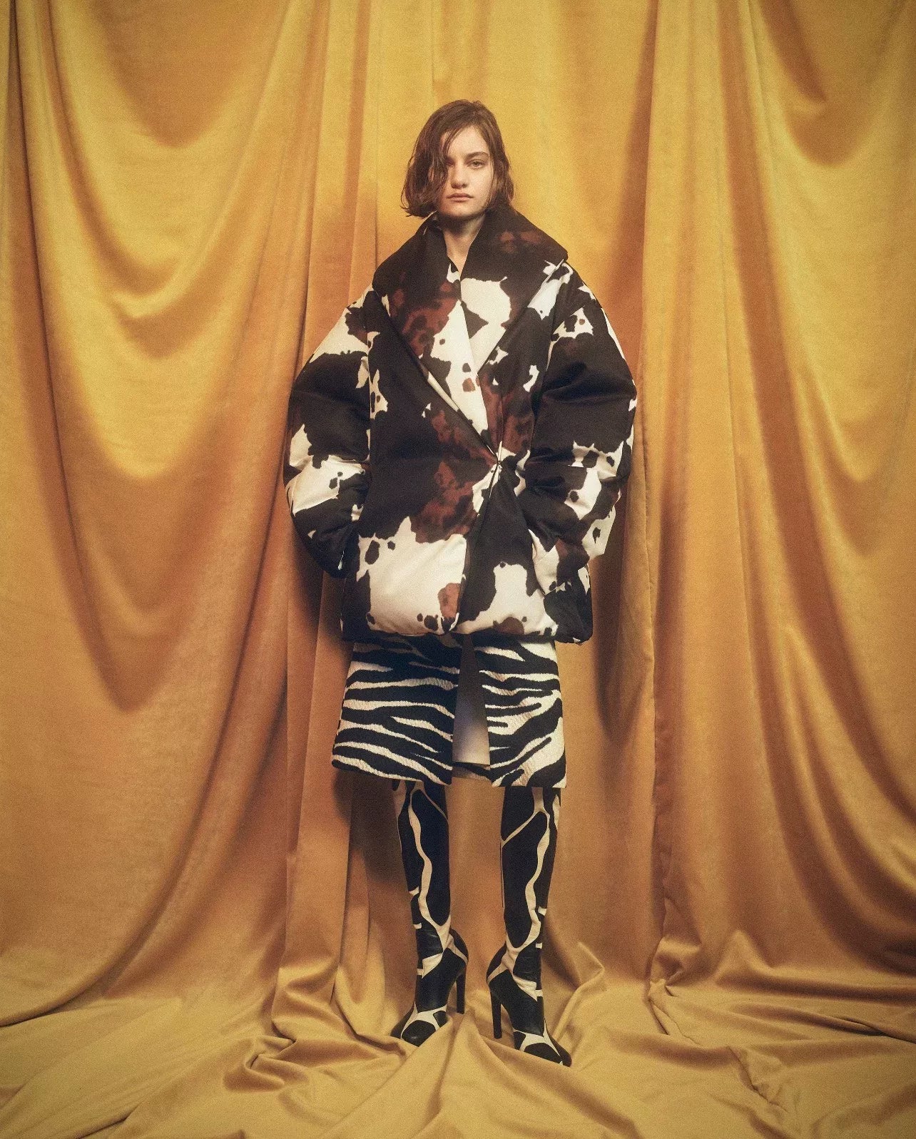 oversized black and white cow print coat