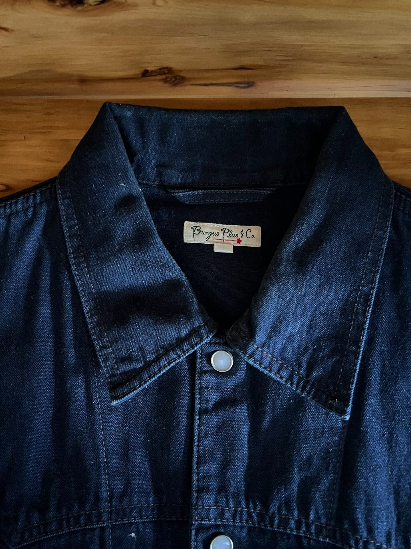 blue dyed work jacket with gem buttons