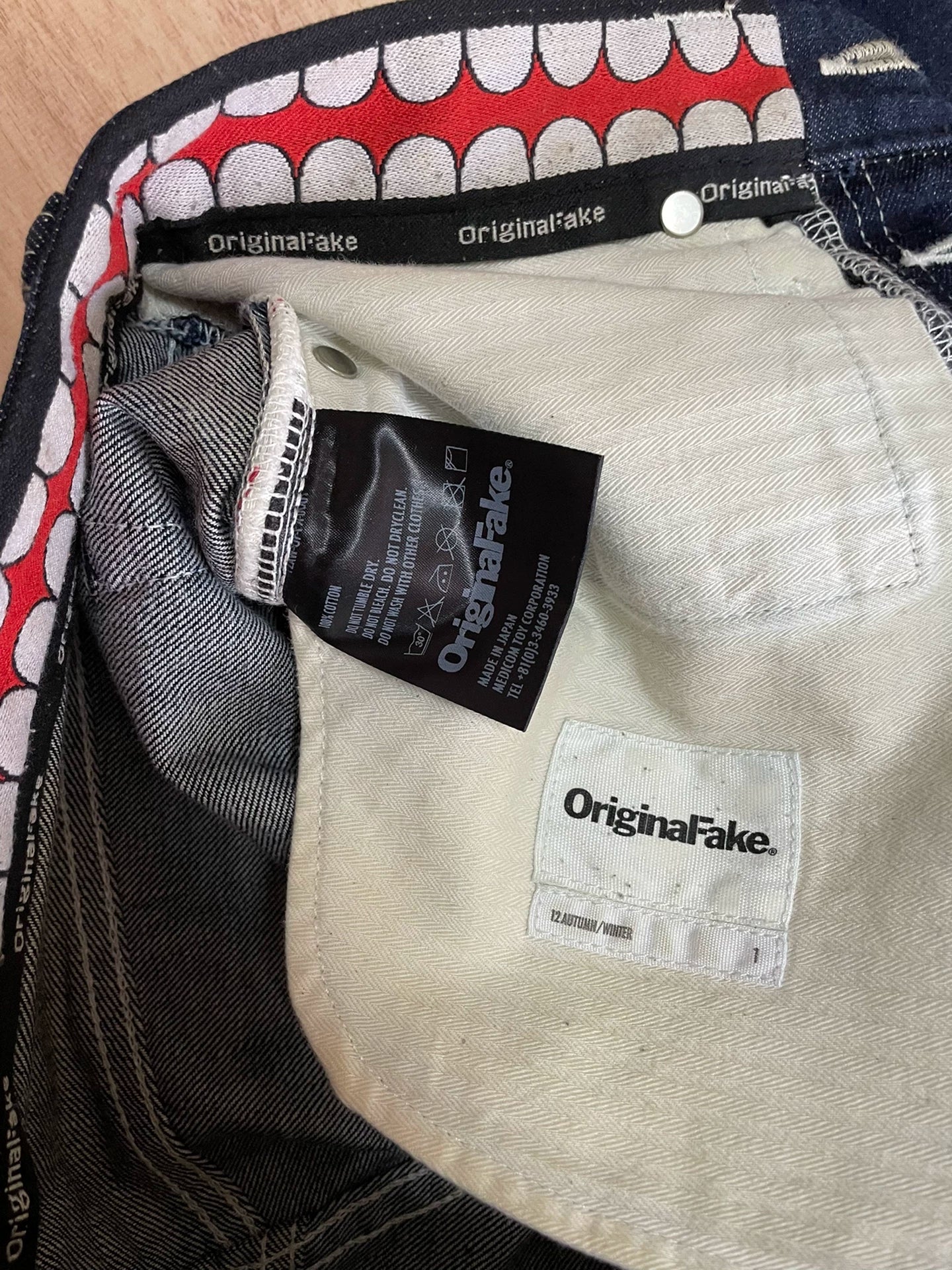 red tooth KAWS original color denim pants