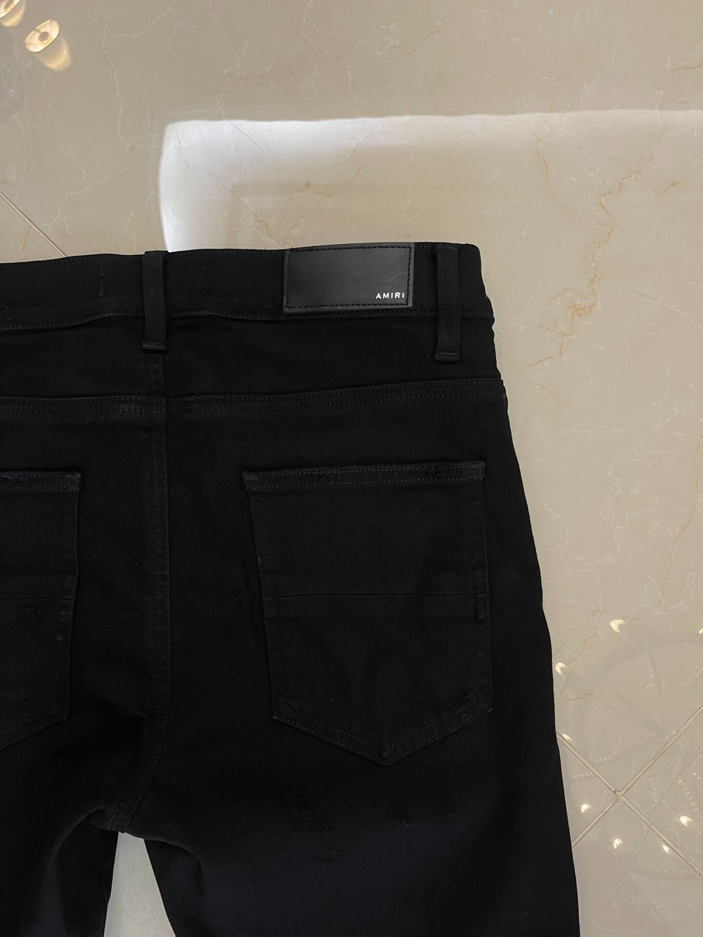 Amiri Black Denim Pants with Artistic Features