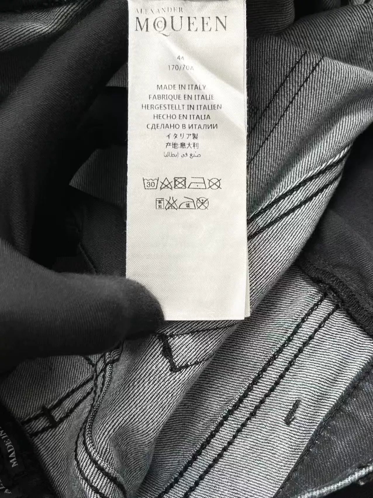 black distressed side-zip jeans by alexander mcqueen