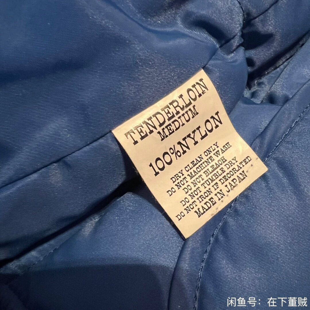 blue down vest by Tenderloin Tokyo