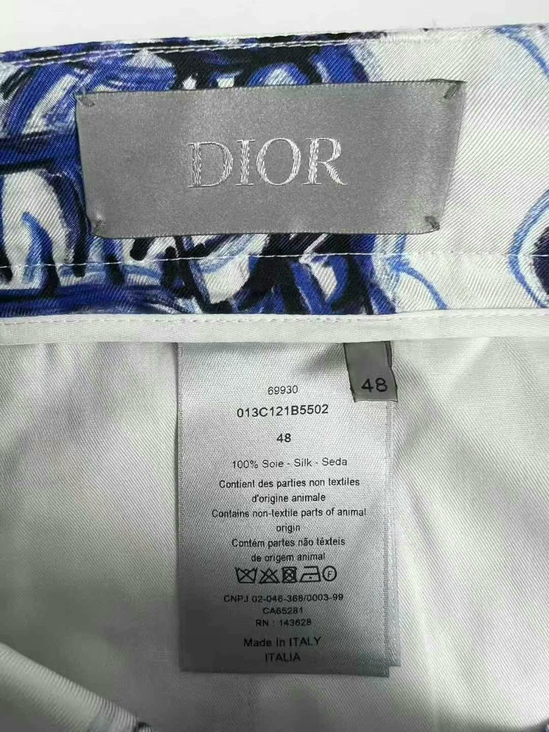 dior tiger logo shorts in white and blue