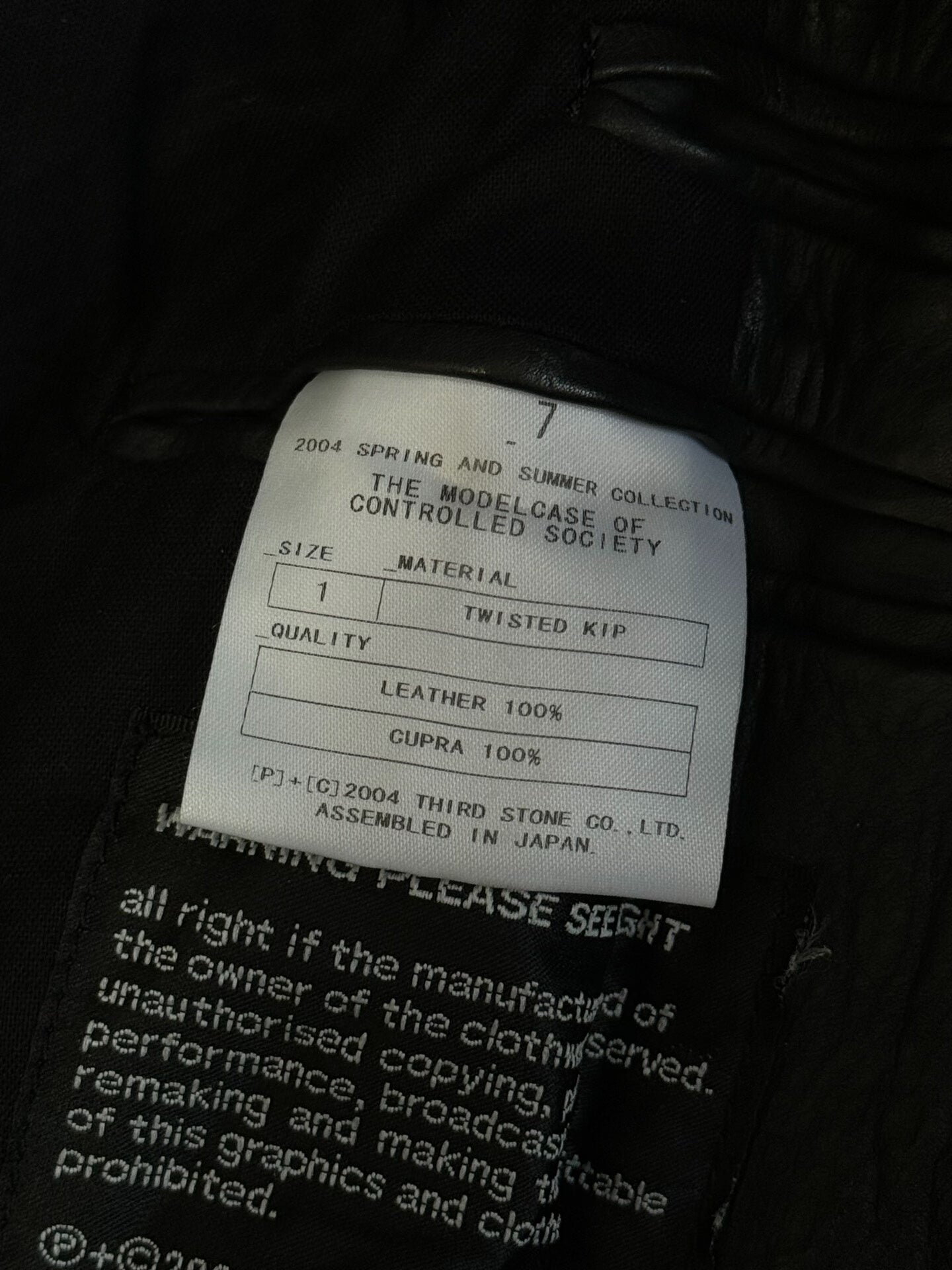 avant-garde crumpled leather suit jacket