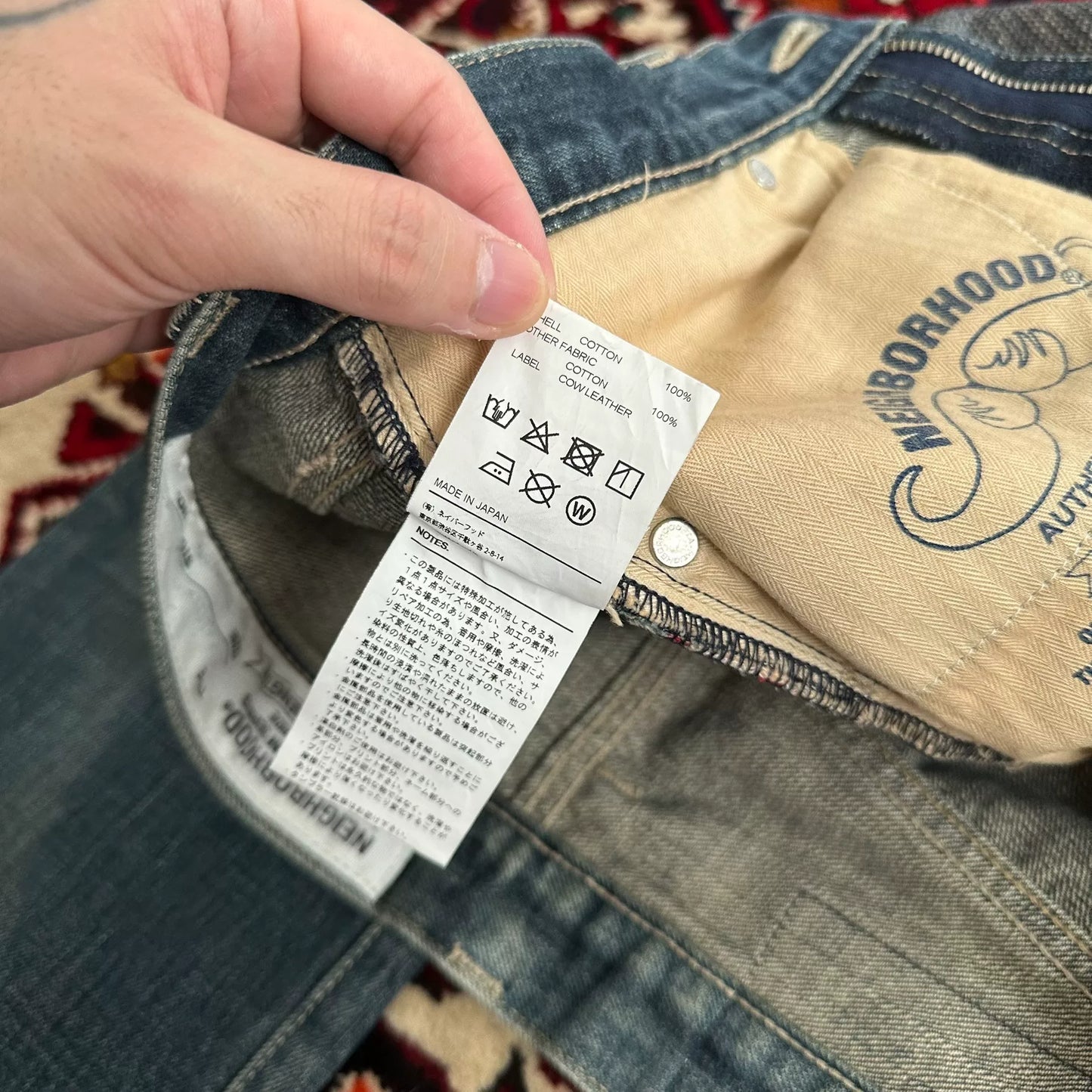 distressed blue jeans with unique detailing