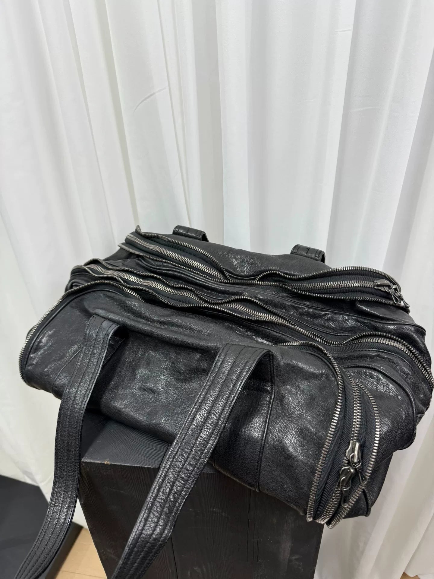 large black zippered handbag