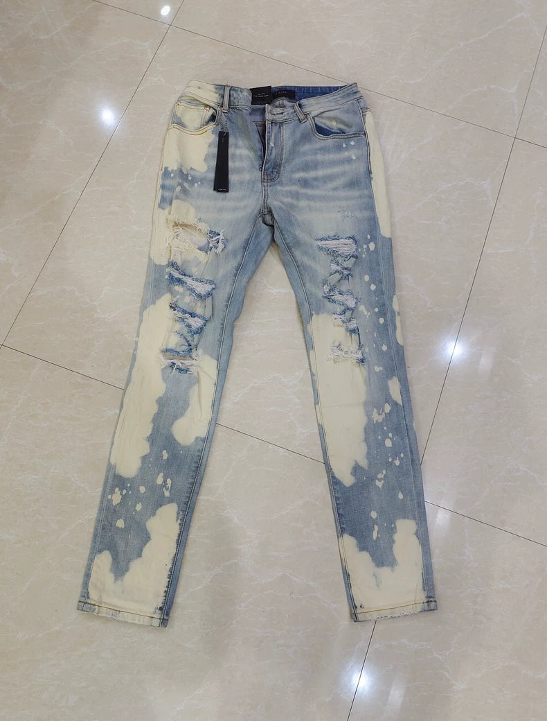 Amiri Splatter Ripped Denim Jeans for Sale