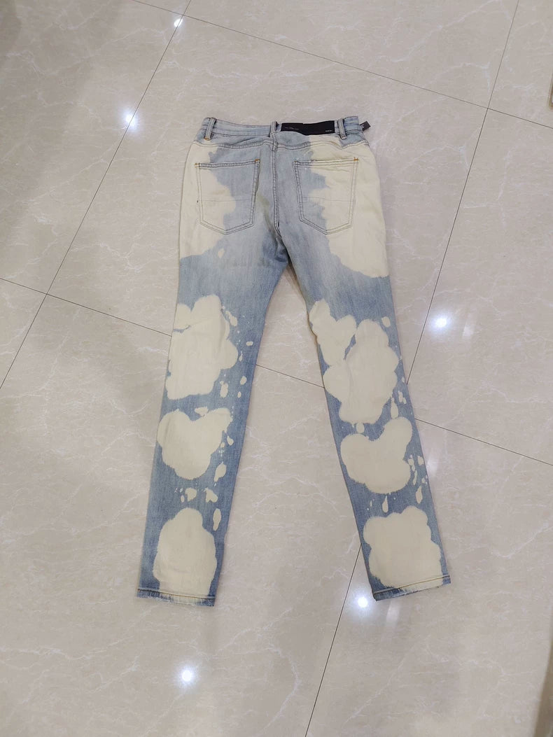Amiri Splatter Ripped Denim Jeans for Sale