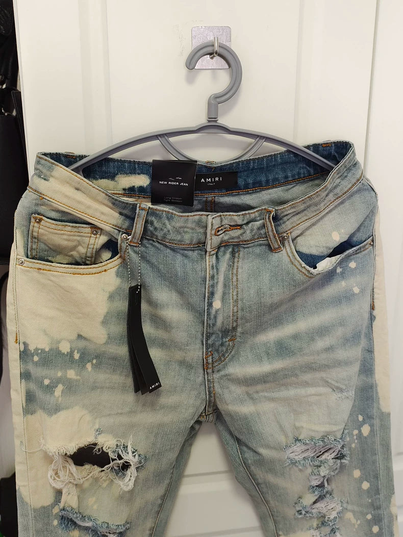 Amiri Splatter Ripped Denim Jeans for Sale
