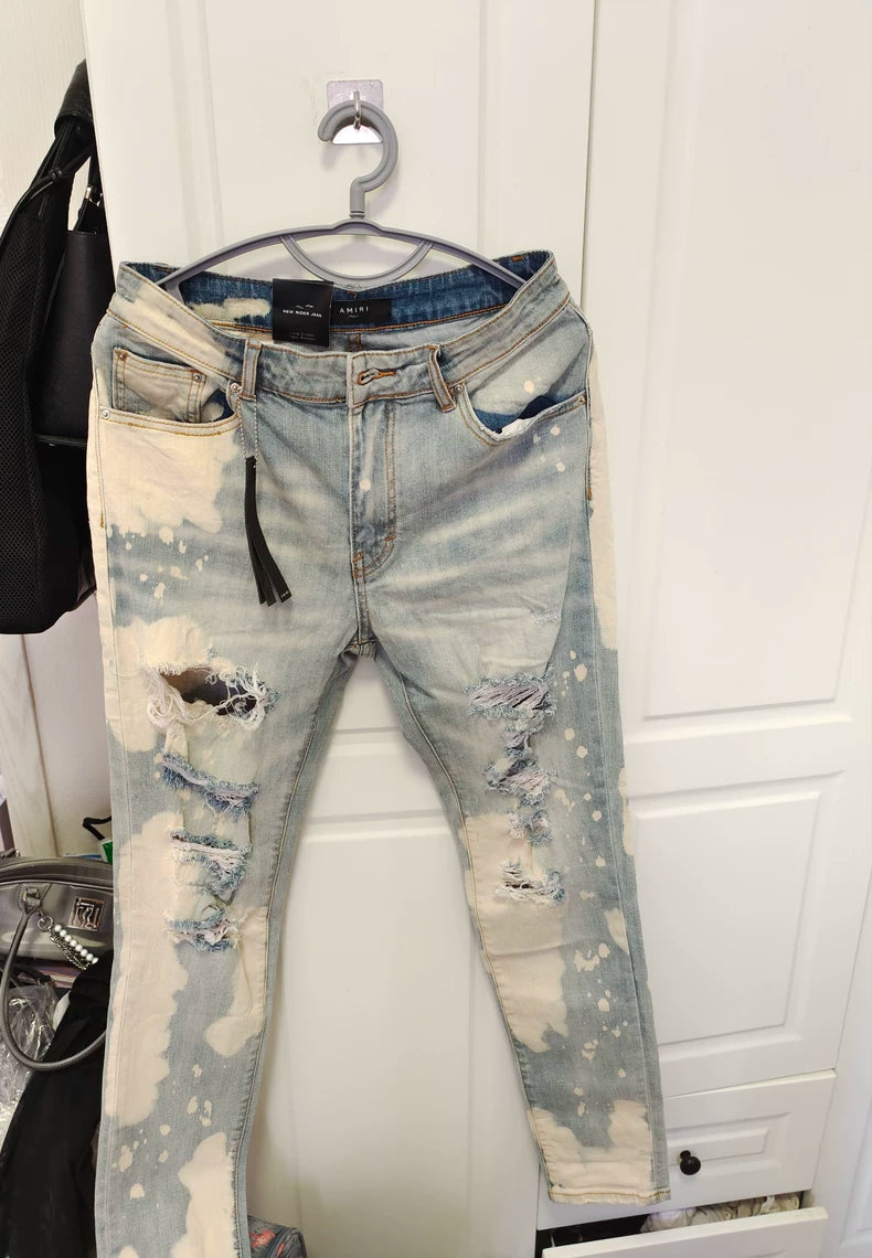 Amiri Splatter Ripped Denim Jeans for Sale