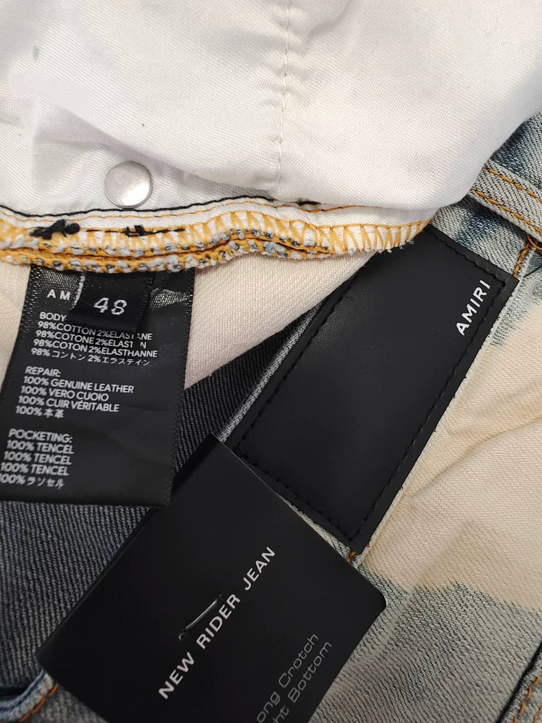 Amiri Splatter Ripped Denim Jeans for Sale