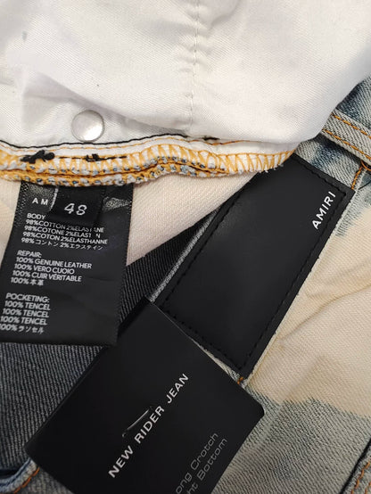 Amiri Splatter Ripped Denim Jeans for Sale