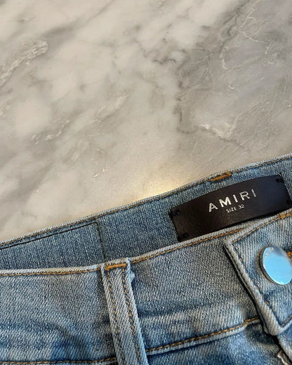 Amiri Thrash MX1 Distressed Denim Pants