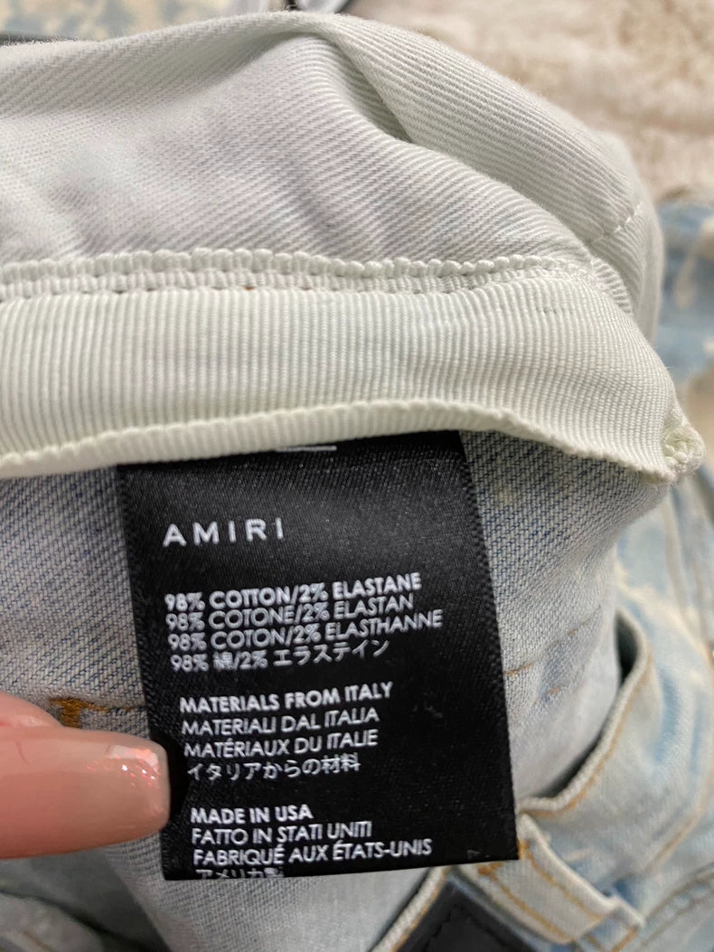 Distressed Blue Denim Pants by Amiri