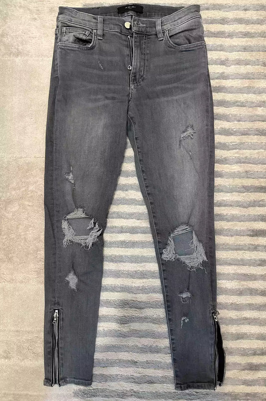 Amiri jeans with holes in the side zipper