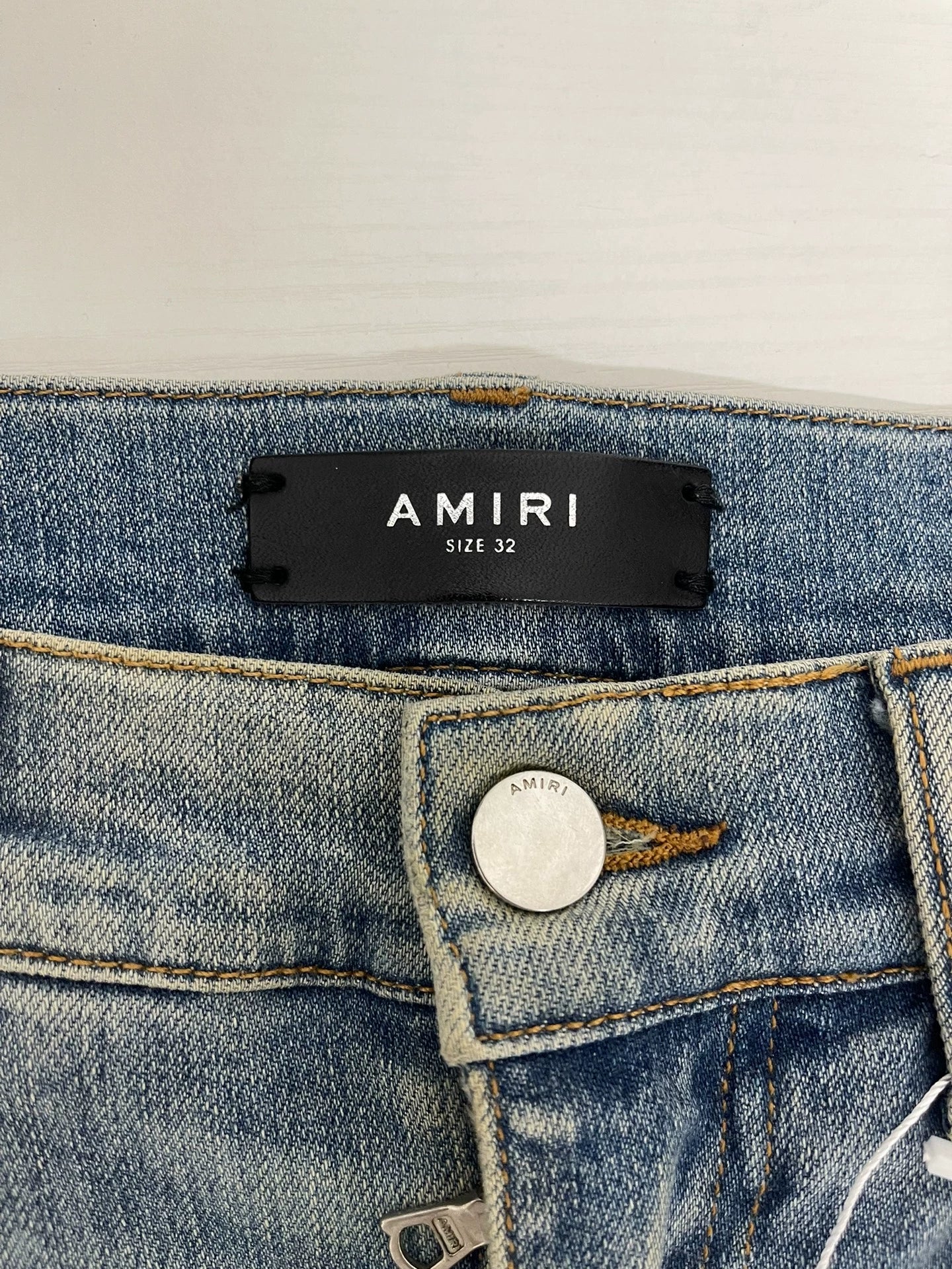 Amiri light blue color rendering ripped jeans