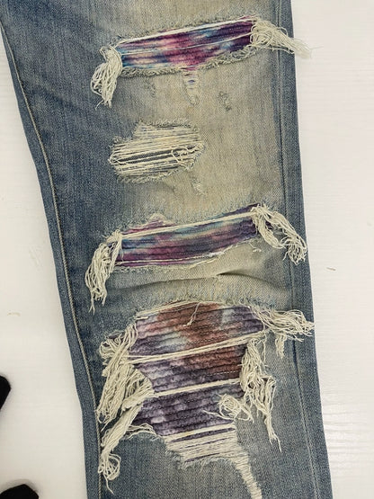 Amiri light blue color rendering ripped jeans