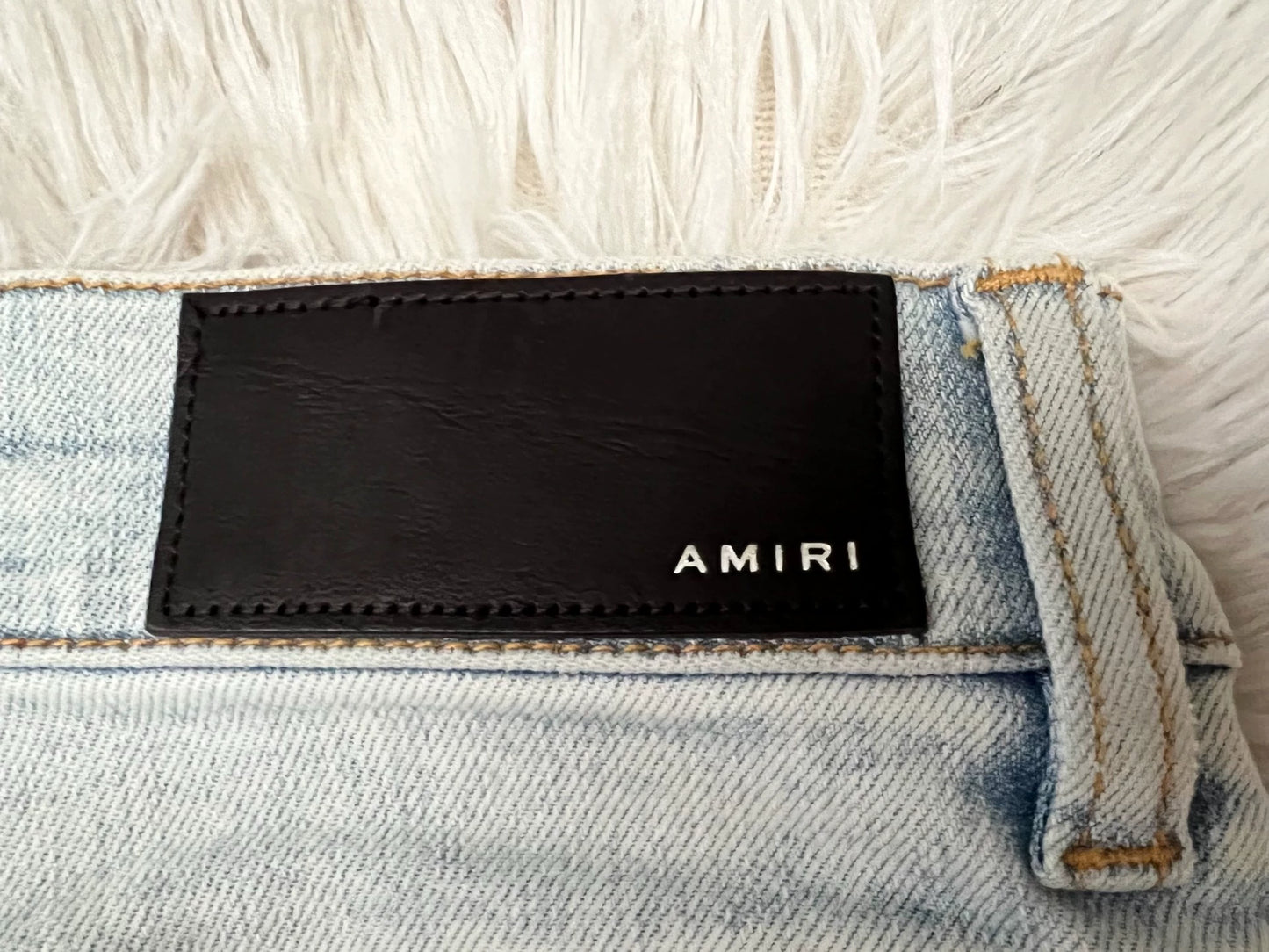 Amiri light colored washed denim jeans