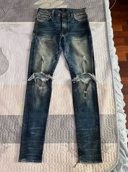 Amiri oil-stained metal damaged jeans - - DMC