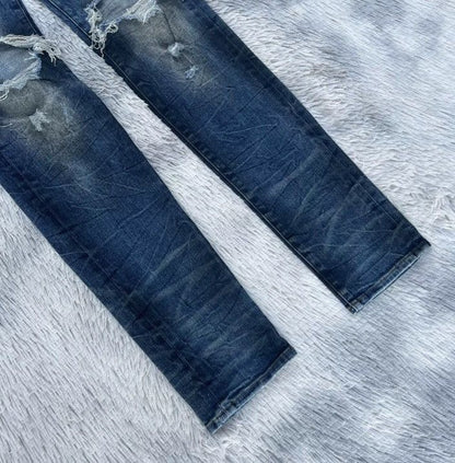 Amiri oil-stained metal damaged jeans - - DMC