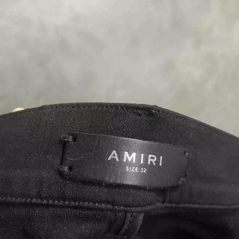 Amiri's latest black cashew flower pattern zipper design jeans