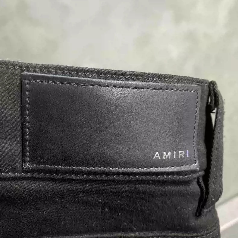 Amiri's latest black cashew flower pattern zipper design jeans