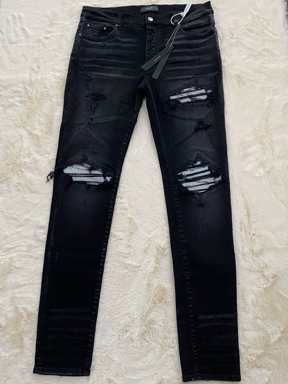 Amiri washed black marble patterned MX1 patchwork jeans