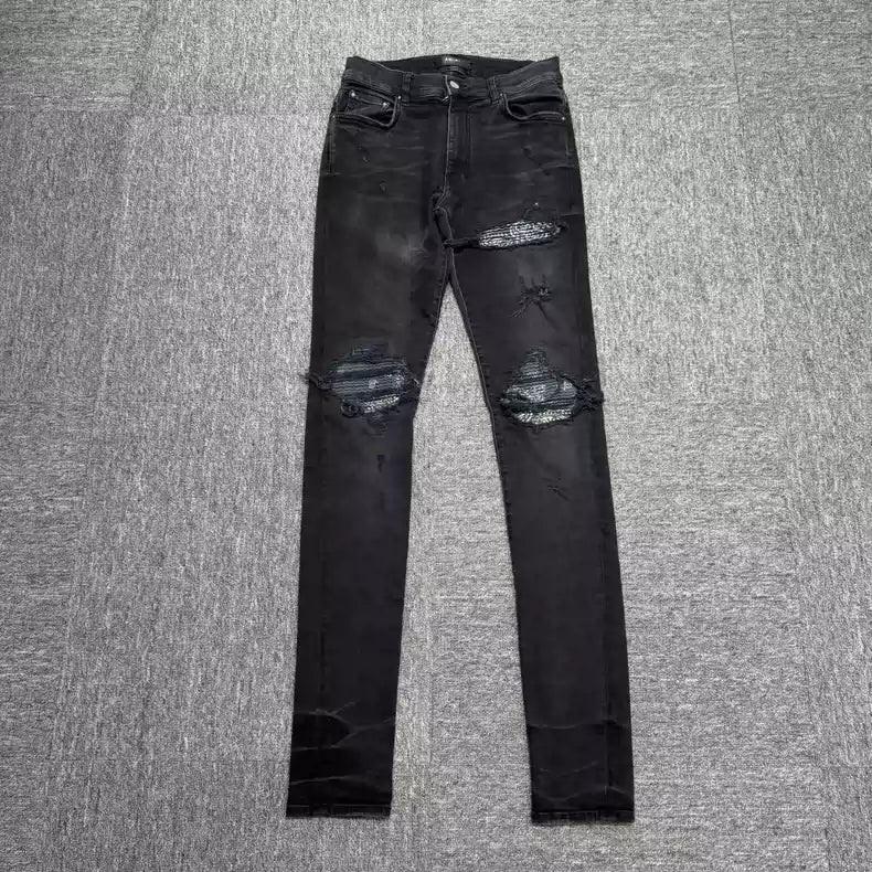 Amiri black cashew flower patchwork jeans