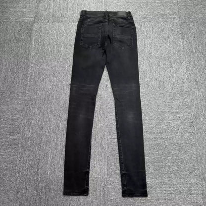 Amiri black cashew flower patchwork jeans