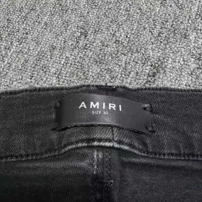 Amiri black cashew flower patchwork jeans