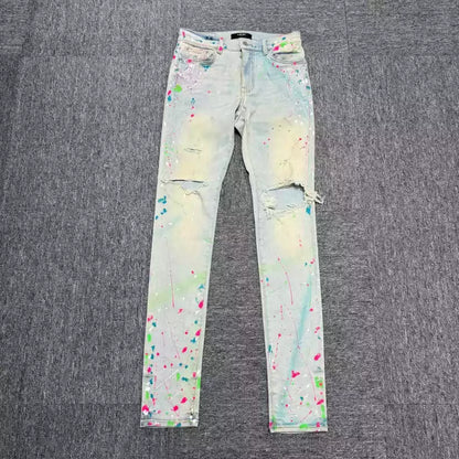 Amiri blue splashed ink ripped jeans