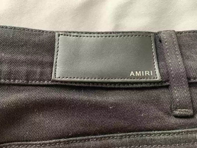 Amiri Double knee damaged black tight jeans