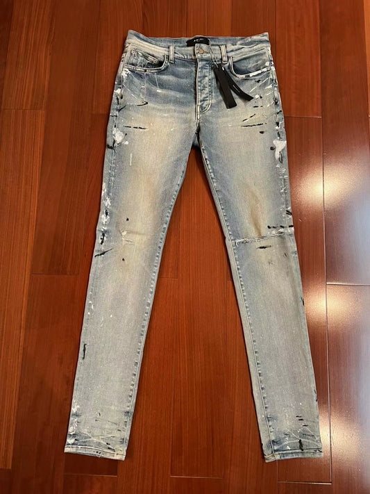 Amiri classic art splatter destroys blue jeans