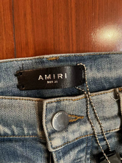 Amiri classic art splatter destroys blue jeans