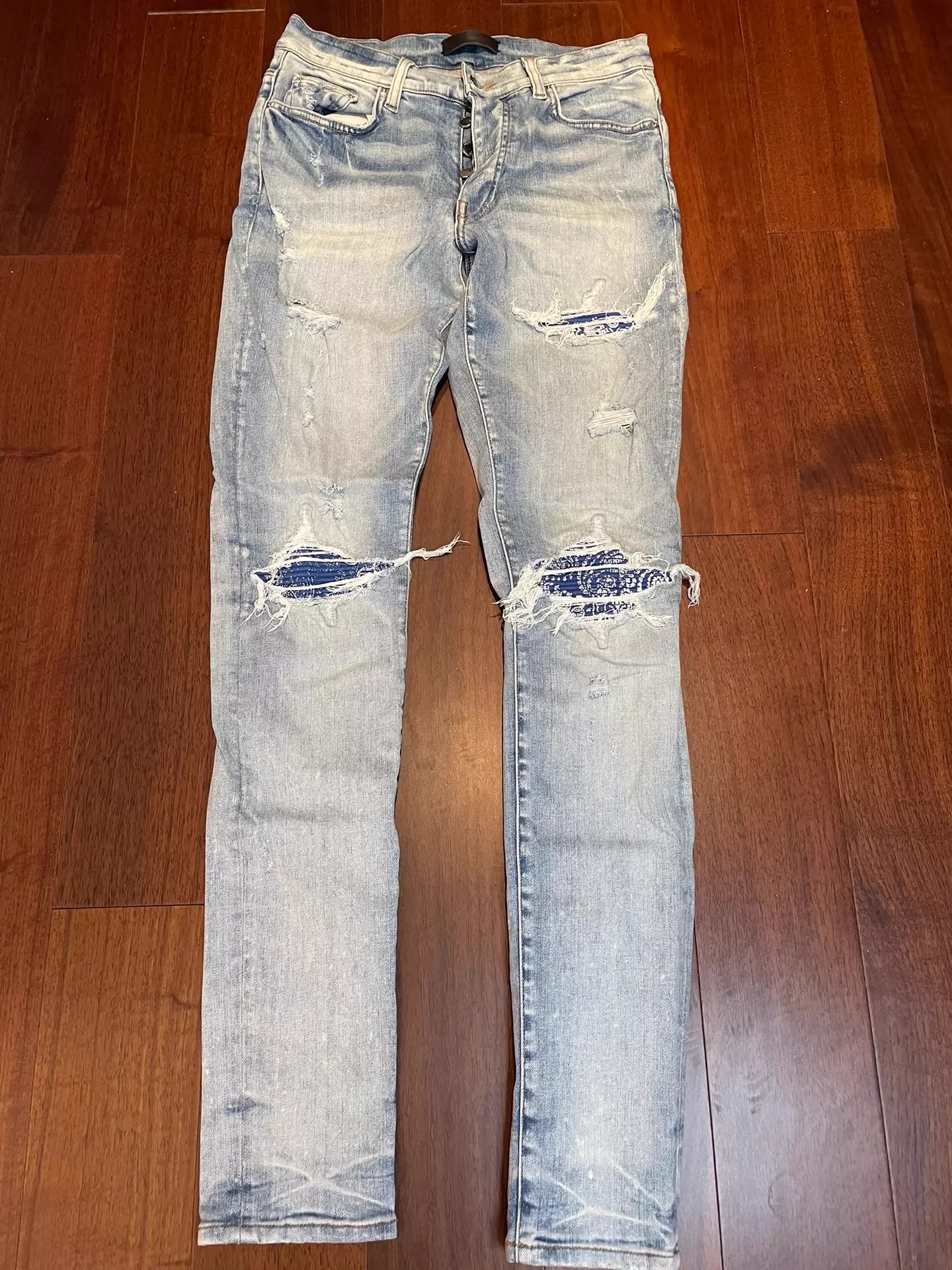 AMIRI light colored cashew flower jeans