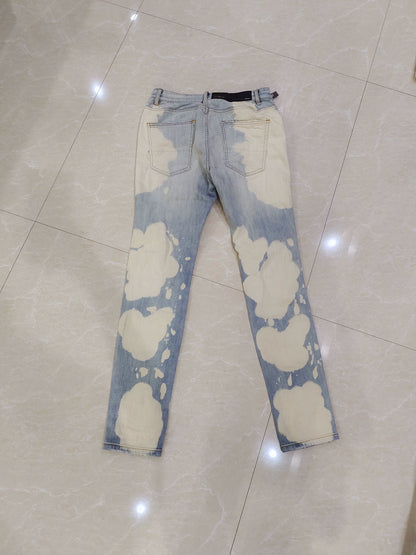 Amiri splashed ink ripped jeans