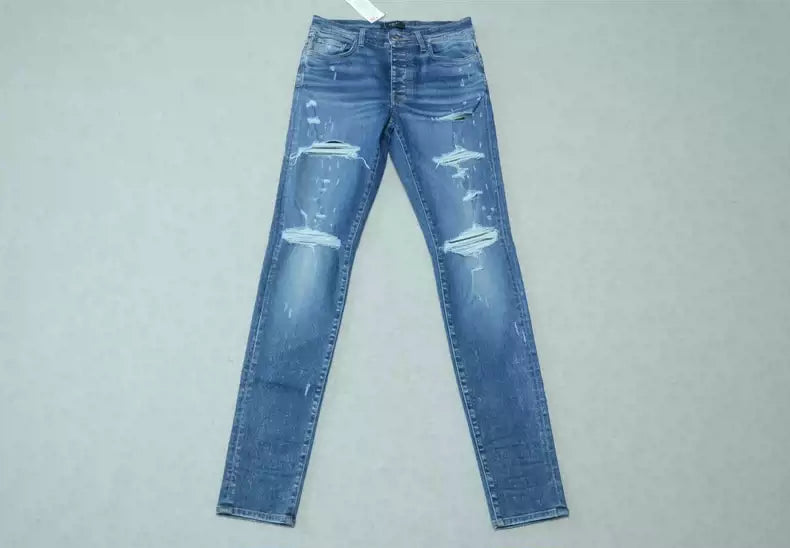 Amiri Blue washed cat paw big damage jeans