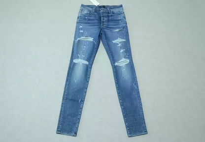 Amiri Blue washed cat paw big damage jeans