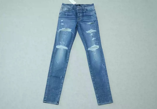 Amiri Blue washed cat paw big damage jeans