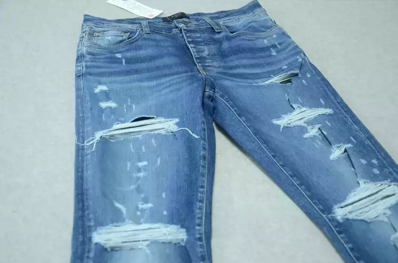 Amiri Blue washed cat paw big damage jeans