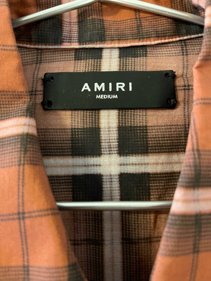 Amiri's early works include checkered shirts