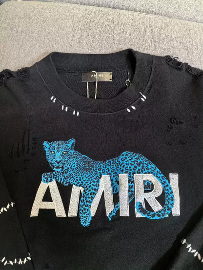 Amiri Blue Panther Logo embroidered extensively, with broken stitching on round neck hoodie