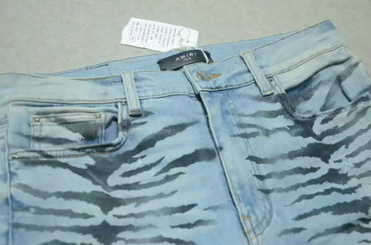 Amiri Blue washed knife cuts and damages jeans and casual pants